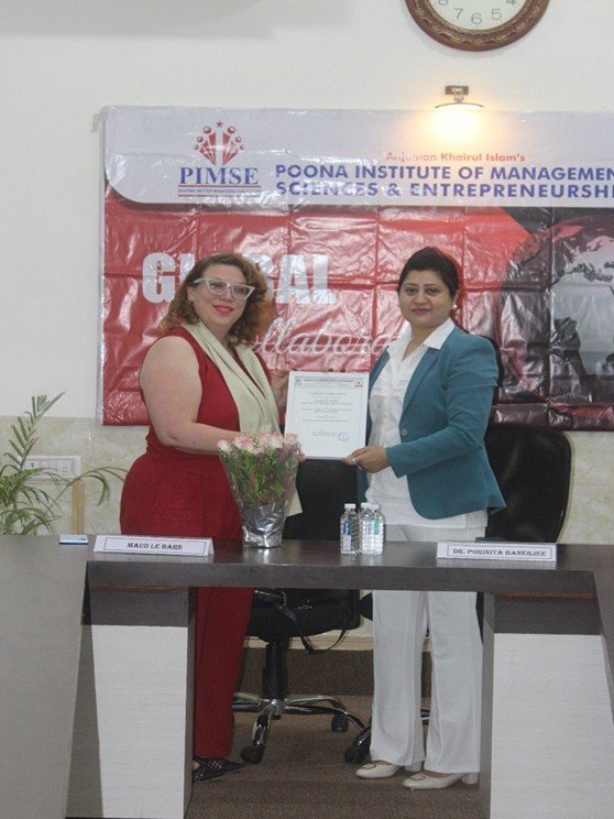 Ms. Maud Le Bars, South Asia Area Manager (France), being felicitated by Director, PIMSE Dr. Porinita Banerjee.